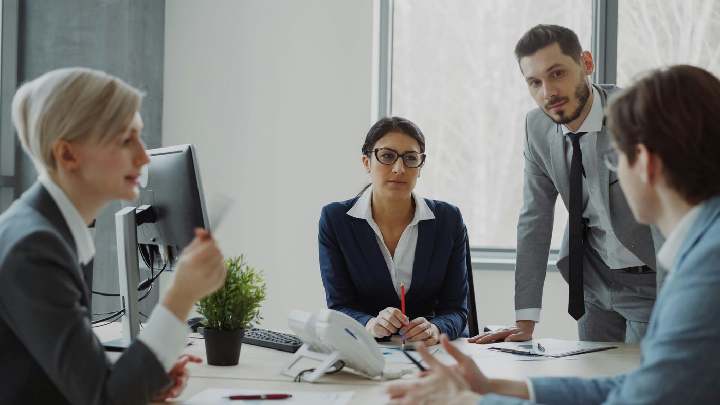 Advisors and business leaders meeting around a table